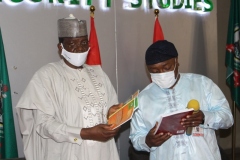 A.S. Adeleke Commandant NISS presenting a Souvenir to H.E Alhaji Bello Muhammad Matawalle