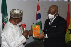 A.S. Adeleke Commandant NISS presenting a Souvenir to  H.E. Hope Uzodinma