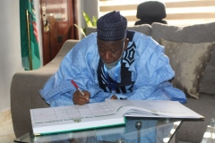 Alhaji-Dr-Umar-Abdullahi-Ganduje-the-executive-Governor-of-Kano-State-sigining-visitors-registers