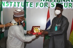 A.S. Adeleke Commandant NISS presenting a Souvenir to H.E. Eng. Abdullahi Sule