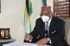 H.E. Hope Uzodinma signing the visitors register